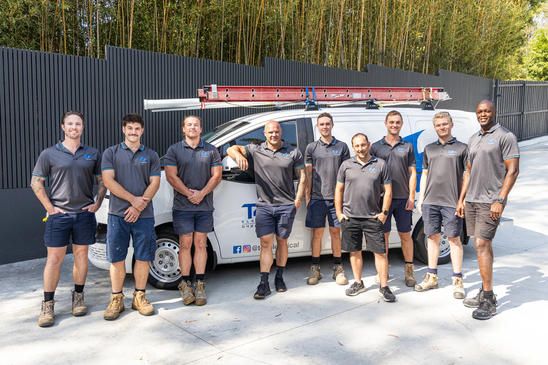 The Family Electrician Highland Park team with a service van